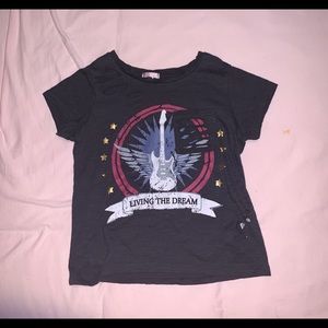 a ripped trendy shirt